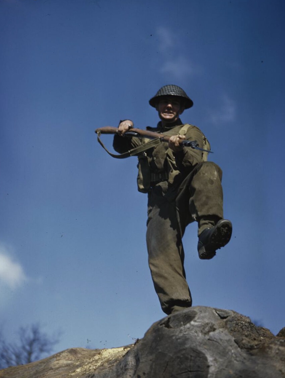Private T Henderson practices an assault with a fixed bayonet during training 